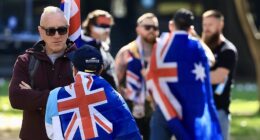 Anti-immigration protests LIVE updates: Moment crowd chants 'Hail Australia' during Sydney rally as protesters are left bloodied by violent clashes in Melbourne and demonstrator flaunts disturbing poster