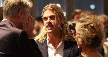 Bailey Smith (pictured centre) shied away from the cameras on Thursday as he attended the 2025 AFL Awards in Melbourne