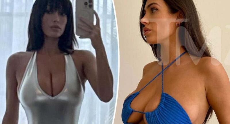 Bianca Censori models metallic bodysuit with plunging neckline