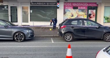 Police have established a crime scene outside a barber shop where two men were stabbed in Queanbeyan