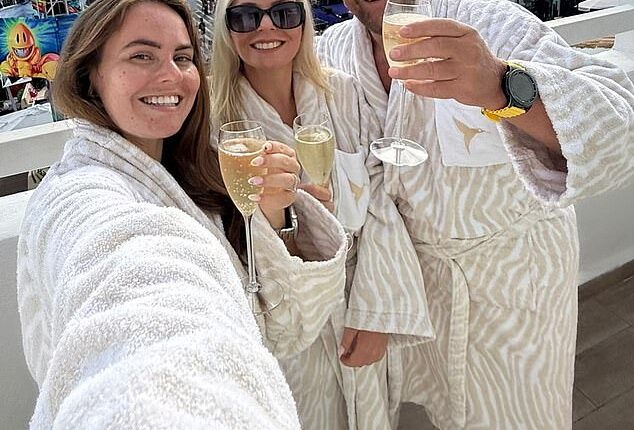 Andy with his two daughters during the 'Den Do' in Ibiza - on their balcony at Ushuaïa where they had a stage-view suite