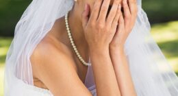 A bride-to-be has sparked a debate online after revealing she's considering cutting guests from her wedding over their reaction to her dress (stock image)