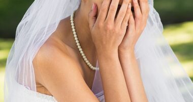 A bride-to-be has sparked a debate online after revealing she's considering cutting guests from her wedding over their reaction to her dress (stock image)