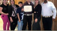 Adela Magan¿a (second from left) lost her arm after a freak accident on a mini golf course where her family (pictured with her) was celebrating her son's birthday