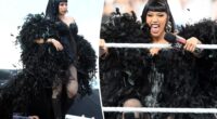 Cardi B hosts WWE SummerSlam in a yards-long feathered cape and corset