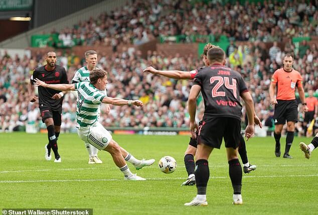 Celtic's Luke McCowan finally breaks St Mirren's resistance with the aid of a deflection