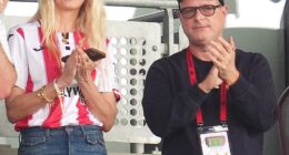 Claudia Schiffer sported a football shirt as she cheered on Brentford with her husband Sir Matthew Vaughn, both 54, at the Gtech Community Stadium on Saturday