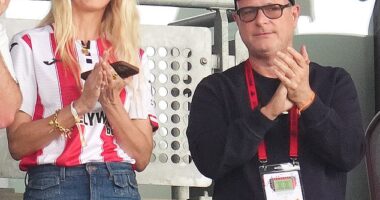 Claudia Schiffer sported a football shirt as she cheered on Brentford with her husband Sir Matthew Vaughn, both 54, at the Gtech Community Stadium on Saturday