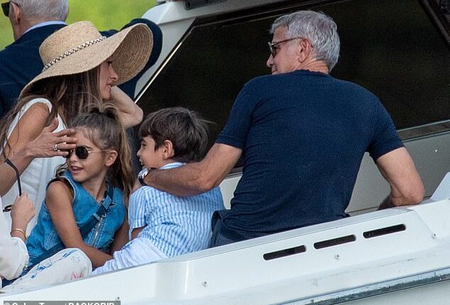 George, 64, Amal, 47, and their eight-year-old twins Ella and Alexander (all pictured) joined a mixed group of friends on Lake Como