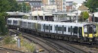 A South Western Railway train leaves Basingstoke station in Hampshire in February 2022