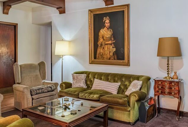 'Portrait of a Lady was pictured hanging over a sofa in a real estate listing posted by Robles Casas & Campos