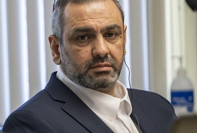 Ihsan Ali, 44, listens as his daughter Fatima Ali tells the court at his attempted murder trial how he tried to choke the life out of her in an alleged 'honor killing'