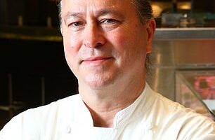 The restaurant war between Sydney hospitality heavyweights Neil Perry and Eddie Levy has taken a twist worthy of any reality cooking show. (Pictured: Neil Perry)