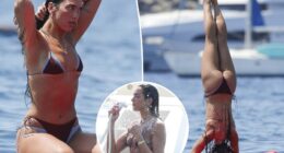 Dua Lipa flaunts her abs during paddleboard yoga in Ibiza
