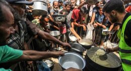 Gaza City will be declared to be in famine for the first time by the international body responsible for monitoring world hunger, it has been reported. Pictured: People carried pots and pans to collect food from aid workers in Gaza on Sunday, August 10