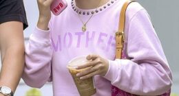 Millie Bobby Brown was spotted out with her husband and their new daughter, and fans think the initials RWB on her phone case might be a clue to her baby's name