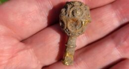 The gold object, which dates back to the 800s, is approximately one and a half inches long and has a decorative ornament on one end
