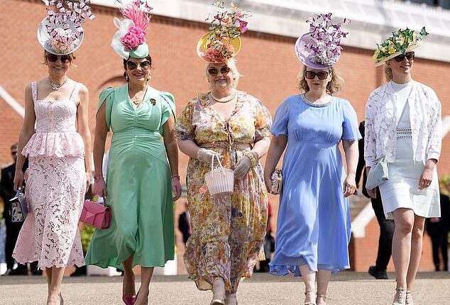 A group of friends arrive at the Chichester racecourse, wearing co-ordinating frocks in a range of pastel tones