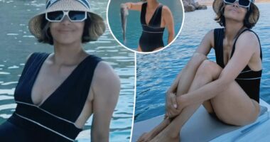 Halle Berry stuns in plunging swimsuit on fishing trip