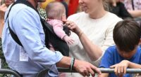 Princess Beatrice her husband Edoardo Mozzi (CL) and children Sienna, Athena and Christopher joins fans lining the Mall waiting to greet the bus carrying the England women's national football team during the homecoming victory parade near Buckingham Palace in London on July 29, 2025