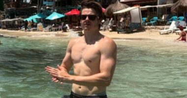 Louis Serkis showed off his ripped torso and bulging biceps while on holiday with his stunning girlfriend on Instagram on Thursday