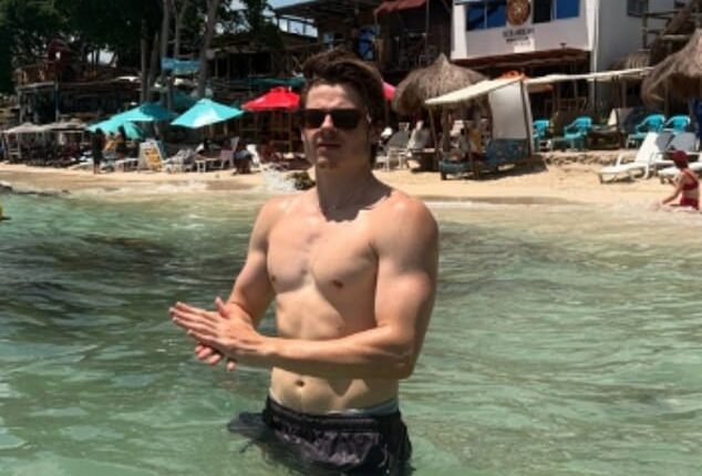 Louis Serkis showed off his ripped torso and bulging biceps while on holiday with his stunning girlfriend on Instagram on Thursday