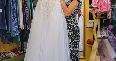 Sales assistant Doriana Laci, 19, at a bridal shop in has showing off the wedding dresses available to Albanian women who marry before their husbands make the illegal journey to the UK