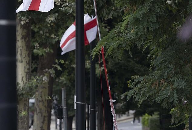 Yesterday, as our pictures show, came the extraordinary spectacle of council workers using extendable shears to remove St George¿s Cross flags from lamp posts in the east London borough of Tower Hamlets