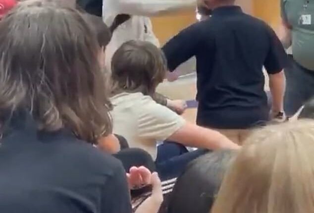 Viral footage shows the hulking Lincoln High School student throwing punches at a staff member before being slammed to the ground