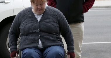 Ian Wilkinson, the sole survivor of the Leongatha mushroom poisonings, comforted his daughter Ruth Dubois (front) in court on Monday as she delivered her victim impact statement