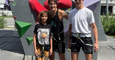Trudeau ditches the suit for a sleeveless tank as he poses with sons Xavier and Hadrien at a climbing gym during their Canadian road trip