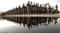Leaders of Iran's Revolutionary Guards are said to have asked Afghanistan 's warlords for 'access' to the bombshell list at the centre of a two-year super-injunction drama in the UK (Pictured: File image of Iran's Revolutionary Guards in 2007)