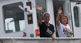 Swedish activist Greta Thunberg waves while departing on the Global Sumud Flotilla, a humanitarian expedition to Gaza, at the port of Barcelona, Spain August 31, 2025