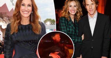 Julia Roberts cuddles up to husband Danny Moder in Venice