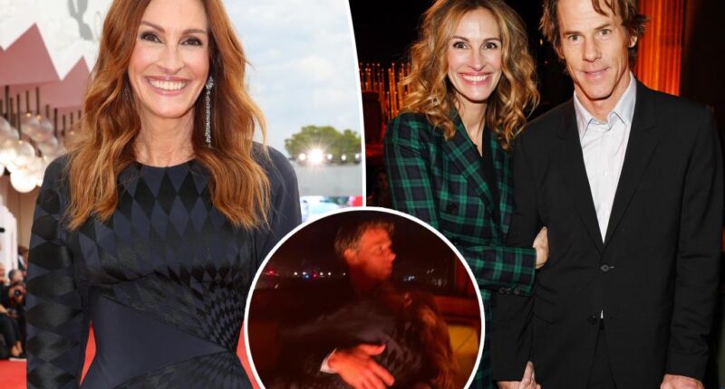 Julia Roberts cuddles up to husband Danny Moder in Venice