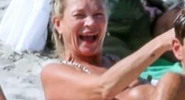 Kate Moss, 51, couldn't contain her giggles as she was surrounded by naked sunbathers on nudist beach in Ibiza on Thursday - before nearly baring all herself!