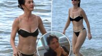 Katy Perry flaunts her chiseled abs in a black bikini