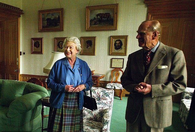 The late Queen Elizabeth and Prince Philip are pictured beaming at someone off-camera as they spent their summer holiday at Balmoral Castle
