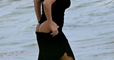 Kourtney Kardashian proudly showed off her pert derriere in a thong swimsuit while on a family holiday just weeks after personally putting an end to pregnancy rumors