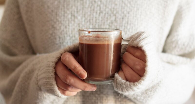 woman holding hot chocolate