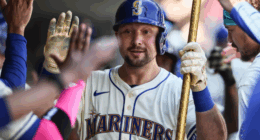 Seattle Mariners catcher Cal Raleigh swings for a home run as he chases Aaron Judge’s AL single-season record.