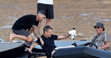 Matt Damon nearly went overboard when he tried to hold on to his beer while stepping into a dingy on what looked like a full day of adventure in Ibiza on Sunday