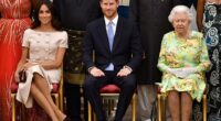 Meghan is pictured with Prince Harry and the late Queen Elizabeth II