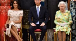 Meghan is pictured with Prince Harry and the late Queen Elizabeth II