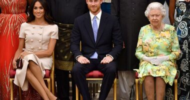 Meghan is pictured with Prince Harry and the late Queen Elizabeth II