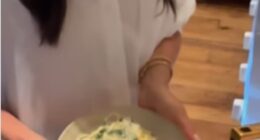 The Duchess of Sussex appeared to be in high spirits as she whipped up a pasta dish while donning a crisp white shirt