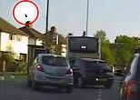 Moment desperate drug dealer gets caught throwing a bag of cocaine out of car window - in a bid to get rid of the evidence