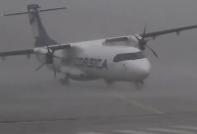 Wind gusts of nearly 100mph nearly overturned a plane stopped on the runway at Cagnano Airport in Corsica