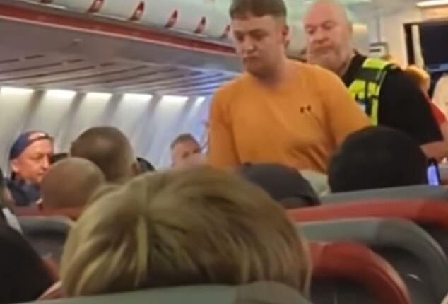 This is the moment passengers on a Jet2 flight erupted into applause as police detained a man after a row with others onboard saw the flight to Alicante diverted back to the UK