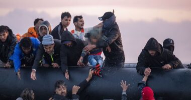 This is the moment (pictured) a small boat arrived at Gravelines beach to pick up migrants to take them illegally across to the UK